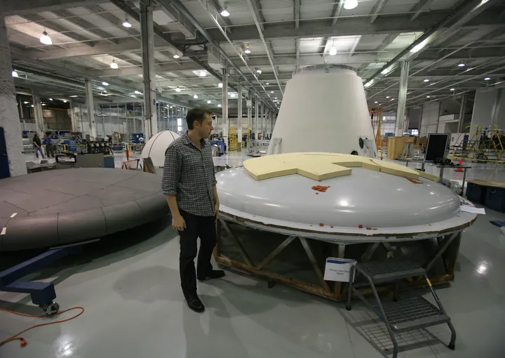 Elon Musk inspecting a heat-shield assembly at SpaceX in 2008.